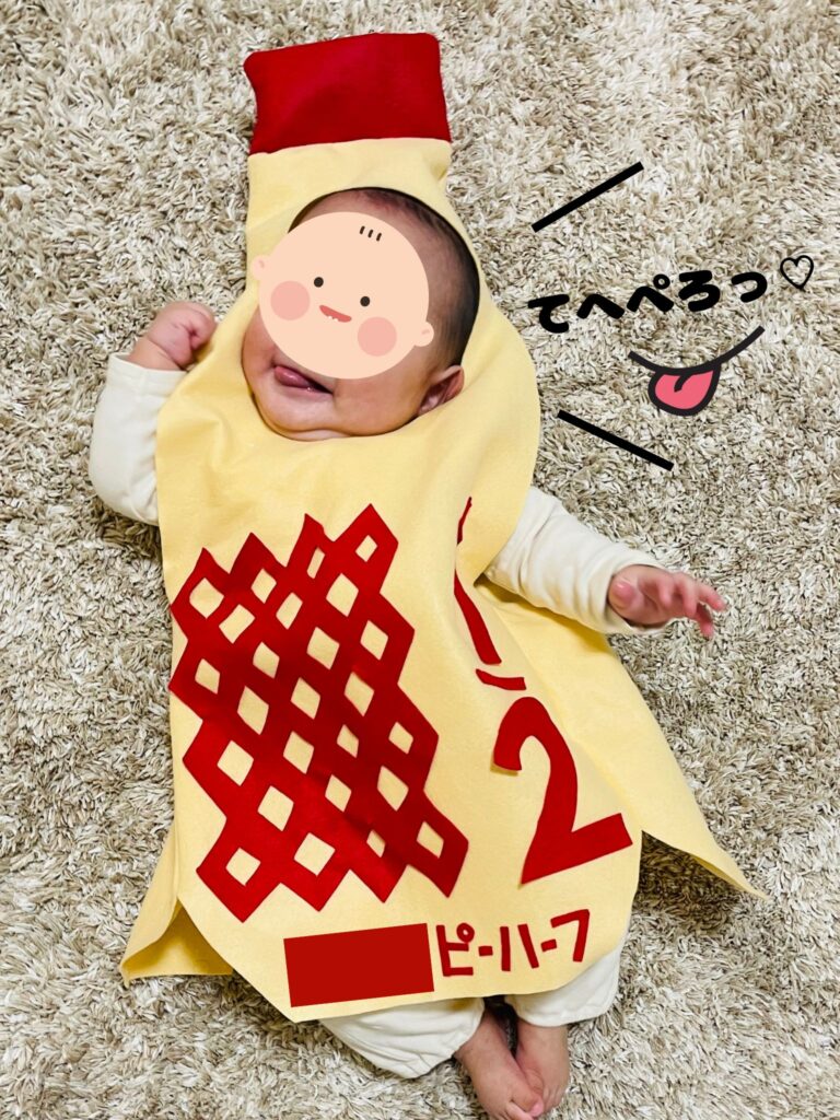 キューピーハーフの着ぐるみを着ている筆者の息子。ぺろっと舌を出しているのが可愛い。